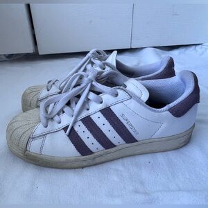 Adidas Superstar shoes in Cloud White and Tech Purple